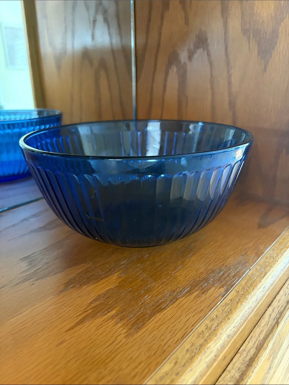 A vintage Pyrex Sculptured mixing bowl in cobalt blue glass.